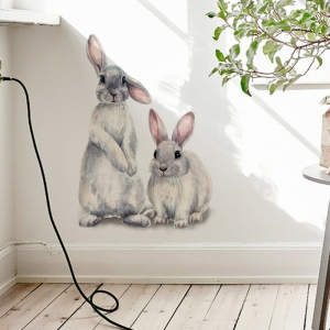 Decorazione da parete di due simpatici coniglietti per ragazze con sfondo bianco