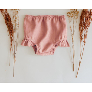 Baby girl bloomer in coton neutro con sfondo beige
