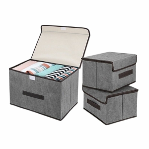 3 scatole portaoggetti in tessuto grigio, una aperta
